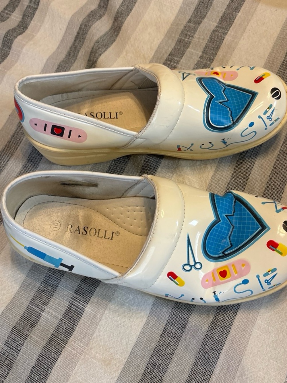 Rasolli White Nursing Mules with Blue Heart and Multicolor Medical Accents